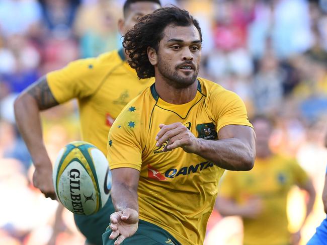 Wallabies player Karmichael Hunt passes during the Test match between the Australian Wallabies and the Italian Azzurri at Suncorp Stadium in Brisbane, Saturday, June 24, 2017. (AAP Image/Dave Hunt) NO ARCHIVING, EDITORIAL USE ONLY