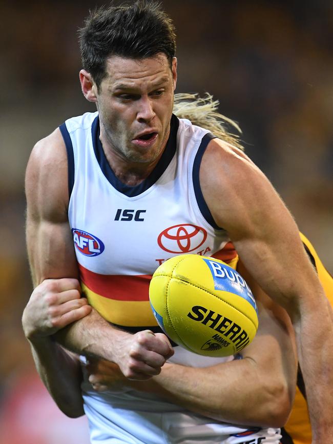 Sam Gibson gest tackled by Hawk Will Langford. Picture: AAP Image/Julian Smith