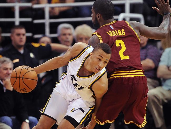 Exum drives around Kyrie Irving of the Cleveland Cavaliers.