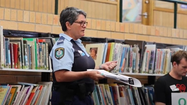 School Liaison Officer Senior Constable Snow of the Coffs/Clarence Police District's Youth and Crime Prevention Command delivers a Love Bites workshop at Toormina High School in this still from a video by And The Trees Photography.