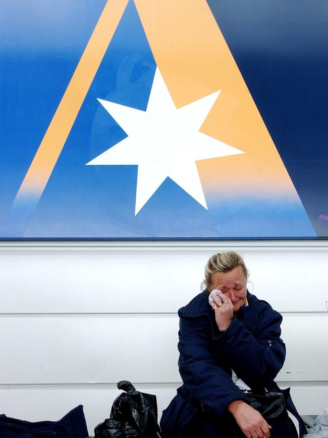 An Ansett employee wipes away tears after the airline was placed into administration in 2001. Picture: AAP