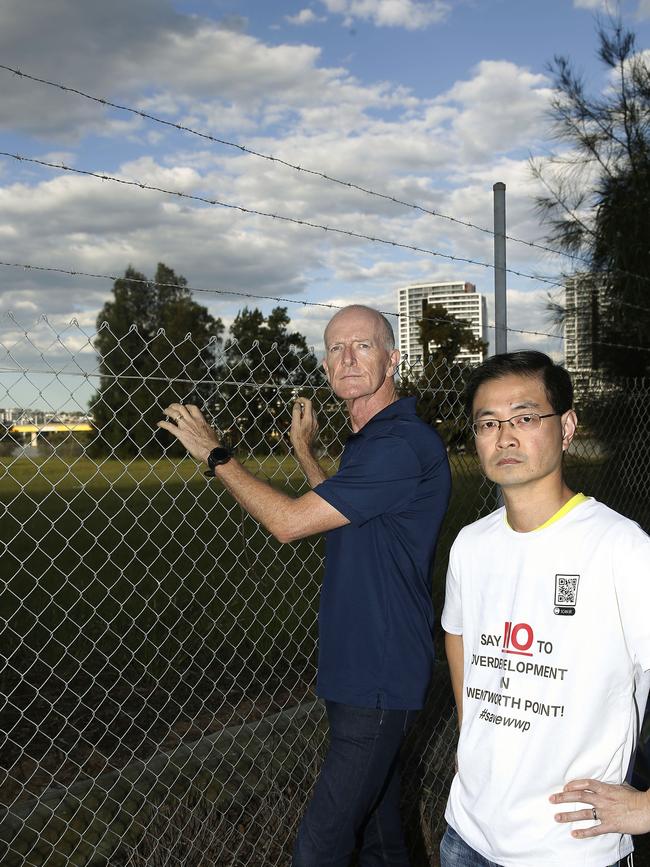 Wentworth Point residents Mark Green and Clement Lun, in 2022, have long campaigned for the creation of Peninsula Park. Picture: John Appleyard