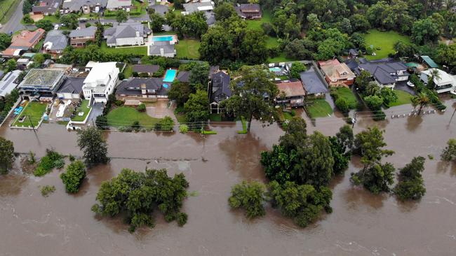 Sydney continues to be drenched in heavy rains causing flooding in local areas and the Warragamba Dam to overflow, sending millions of litres of water down the Nepean River to low lying areas like Emu Plains. Rising flood waters are threatening homes along River Rd in Emu Plains. Picture: Toby Zerna