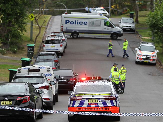 Police officers in the street after cordoning off the area. Picture: Martin Lange