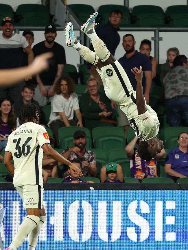 Nestory Irankunda celebrates scoring an A League goal for Adelaide with one of his trademark backflips. Picture: Paul Kane/Getty Images