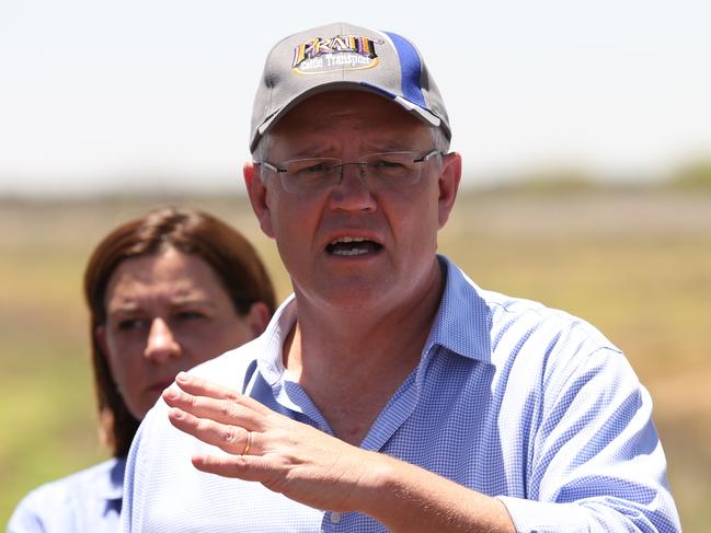 15/2/2019: PM Scott Morrison holds a press conference on the main road after he inspected the twisted and destroyed main railway line running between Mount Isa and Townsville with local mayors, which is surrounded by the rotting carcasses of dead cattle  after floods sweep through the area earlier this week,  just east of Julia Creek about 3 hrs east of Mount Isa. The railway line may be unusable for some time, with a huge amount of repair work to be done . Lyndon Mechielsen/The Australian