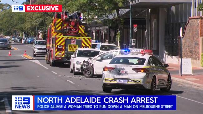 A woman allegedly tried to run a man down before crashing her car onto a busy North Adelaide footpath. Picture: NINE NEWS