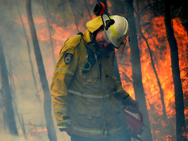 Rural Fire fighters establish a backburn in Mangrove Mountain, NSW on December 8, 2019. Picture: Jeremy Piper