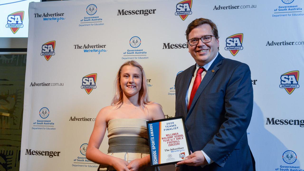 Education Minister John Gardner with finalist captain from Willunga Waldorf School Year 6/7 Girls Football team at The School Sports Awards at the SA Museum. Picture: Brenton Edwards