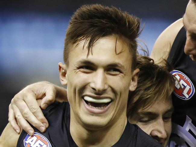 Josh Deluca of the Blues (left) celebrates a goal during the Round 18 AFL match between the Carlton Blues and the Gold Coast Suns at Marvel Stadium in Melbourne, Saturday, July 20, 2019. (AAP Image/Daniel Pockett) NO ARCHIVING, EDITORIAL USE ONLY