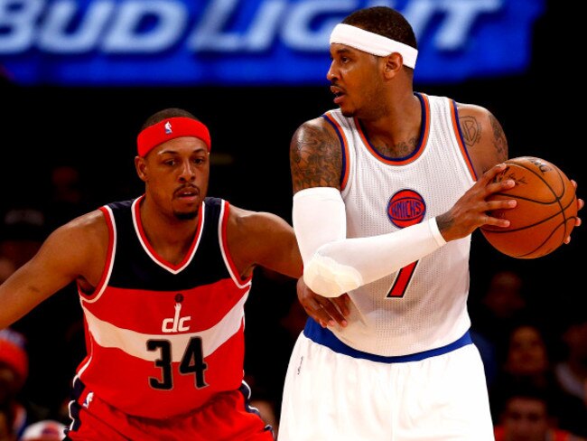 Paul Pierce #34 of the Washington Wizards guards Carmelo Anthony #7 of the New York Knicks.