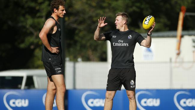 Buckley in deep conversation with Jarrod Witts. Picture: Colleen Petch.