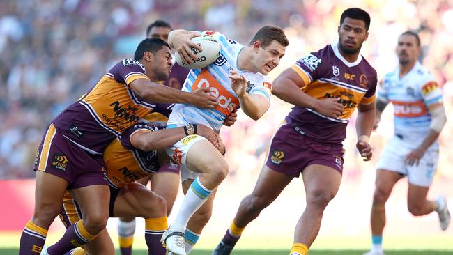 BRISBANE, AUSTRALIA - JUNE 09: Ryley Jacks of the Titans tries to break free during the round 13 NRL match between the Brisbane Broncos and the Gold Coast Titans at Suncorp Stadium on June 09, 2019 in Brisbane, Australia. (Photo by Jono Searle/Getty Images)