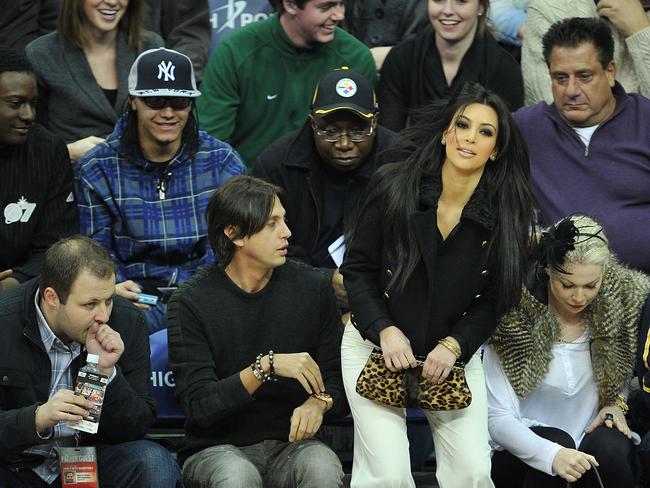 Kim gains a whole row of admirers when she attends the Dallas Mavericks vs. New Jersey Nets basketball game in Newark, New Jersey. Picture: Getty