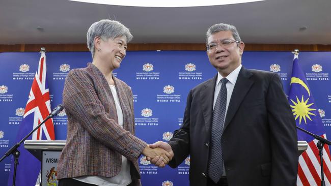 Australian Foreign Affairs Minister Penny Wong shakes hands with Malaysian Foreign Minister Saifuddin Abdullah on June 28, 2022. Picture: The Australian / Joshua Paul