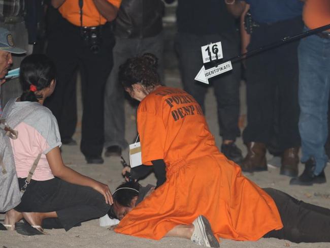 Sara Connor during a re-enactment on Kuta Beach appears to act out hitting an officer with a walkie talkie. Picture: Zul Edoardo.