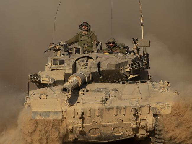 ISRAEL - JULY 08: An Israeli soldiers sit on a tank as he is moving a long the border with the Gaza Strip on July 8, 2024 in Southern Israel. More than nine months have passed since the Oct. 7 attacks by Hamas, which spurred Israel's invasion of Gaza. Fighting there continued over the weekend, although there have been reports of progress with negotiations around a potential cease-fire deal. (Photo by Amir Levy/Getty Images) *** BESTPIX ***