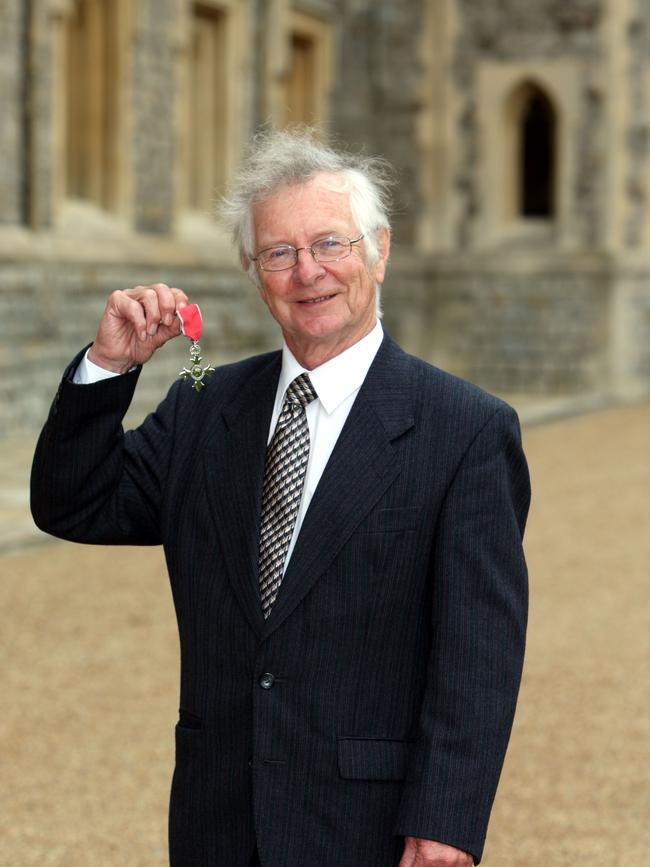 Dr. Frank Duckworth poses after he was made a Member of the British Empire (MBE). Photo by Steve Parsons - WPA Pool/Getty Images.