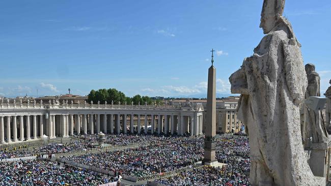 People attend a holy mass a day after the funeral of Pope Francis, at St Peter's square with the obelisk and the colonnade, in The Vatican, on April 27, 2025. (Photo by Damien MEYER / AFP)