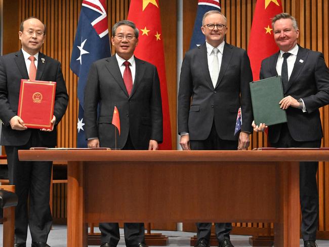 Australia's Prime Minister Anthony Albanese (2nd R) and Minister for Climate Change Chris Bowen (R) pose for pictures with China's Premier Li Qiang (2nd L) and Chinaâs Ambassador to Australia Xiao Qian during a signing ceremony at Parliament House in Canberra on June 17, 2024. (Photo by MICK TSIKAS / POOL / AFP)