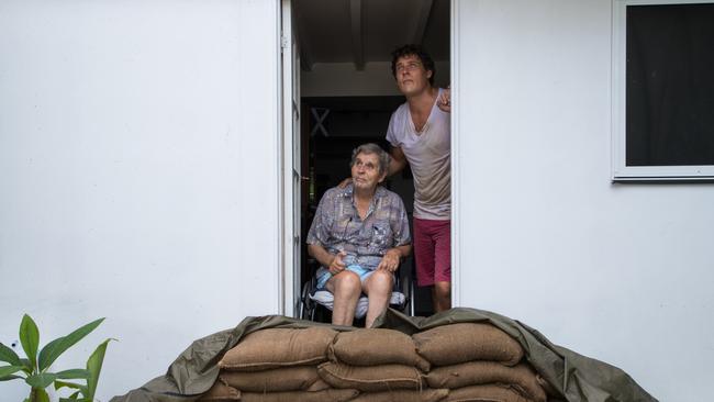 Parramatta Park resident John Irving, 81, had his front door sandbagged by his son Steve Irving as Cyclone Owen dumps heavy rain in the region in Cairns, Queensland, Saturday, December 15, 2018. Picture: AAP Image