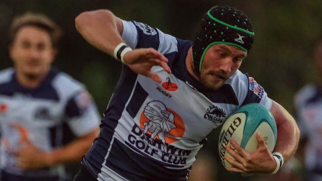 NT Rugby Union. Zac Phillips evades the Palmerston defence. Picture: GLENN CAMPBELL