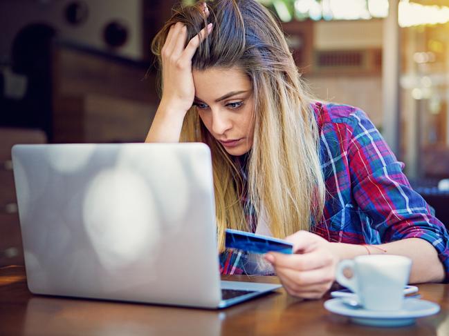 Young girl have problems with her credit card till shopping online. istock photo