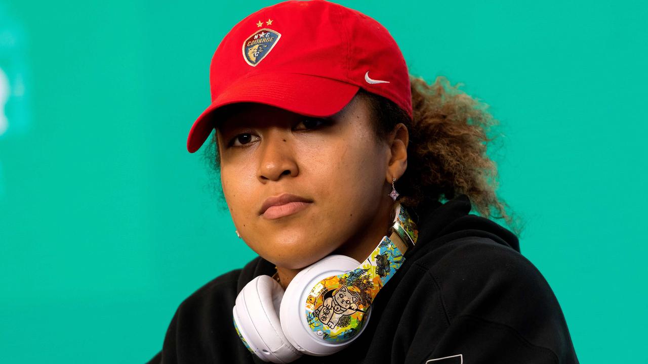 Former Australian Open champion Naomi Osaka called out racist posts on social media (Photo by VINCE CALIGIURI / TENNIS AUSTRALIA / AFP)