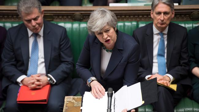 A handout photograph released by the UK Parliament on March 13, 2019 shows Britain's Prime Minister Theresa May speaking during the weekly Prime Ministers Questions session in the House of Commons in London on March 13, 2019. - Britain's finance minister and business chiefs on Wednesday urged the country to avoid a "no deal" Brexit after another crushing parliamentary defeat for Prime Minister Theresa May over her EU-divorce deal with Brussels. The fast-moving Brexit saga largely overshadowed the government's budget update that slashed the 2019 economic growth forecast, with the UK economy also hit by China's slowdown and trade war tensions. MPs will decide later Wednesday whether the country should leave the European Union without a deal, with analysts expecting parliament instead to favour delaying its departure beyond the March 29 exit date, in a further vote due Thursday. (Photo by JESSICA TAYLOR / UK PARLIAMENT / AFP) / RESTRICTED TO EDITORIAL USE - NO USE FOR ENTERTAINMENT, SATIRICAL, ADVERTISING PURPOSES - MANDATORY CREDIT " AFP PHOTO / JESSICA TAYLOR / UK Parliament"