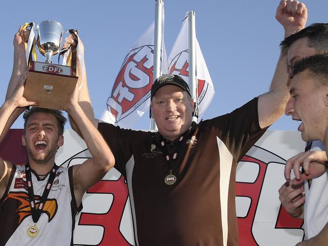 Craigieburn co-captains Christian Mcerlain and Jamie Gorgievskiwith coach Lance Whitnall  recieve the cup after winning the EDFL grand final between Craigieburn and East Keilor in Essendon, Saturday, Sept. 14, 2019. Picture: Andy Brownbill