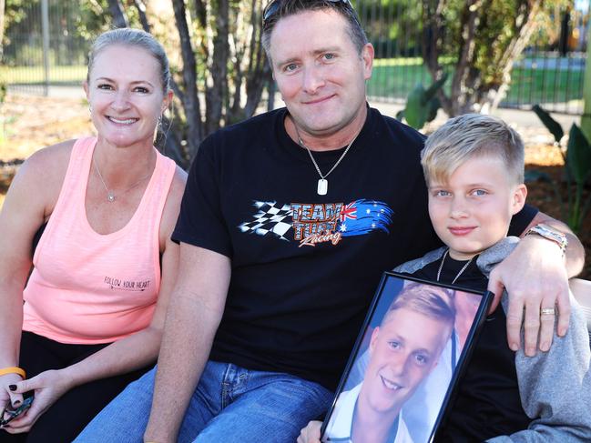 Simon, Darren, and there 11 year old son Cody Tickell sit on the Blake Tickell's memorial bench next to the garden at Burnie Mullane sports complex, Kellyville. Kellyville, Friday, June 22nd 2018. Blake Tickell, 15, the 2017 RHT JSS Star, died in a water skiing accident last December. Now the family and the Hills shire Council are honouring him by unveiling memorials at Burnie Mullane sports complex. (AAP Image / Angelo Velardo)