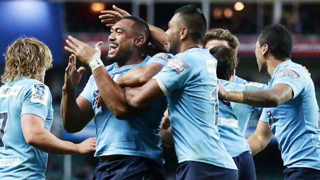 SYDNEY, AUSTRALIA - JULY 06: Sekope Kepu of the Waratahs celebrates with team mates after scoring a try during the round 18 Super Rugby match between the Waratahs and the Highlanders at Allianz Stadium on July 6, 2014 in Sydney, Australia. (Photo by Matt King/Getty Images)