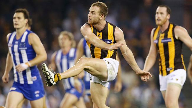 Tom Mitchell clears out of the middle. Picture: Michael Klein