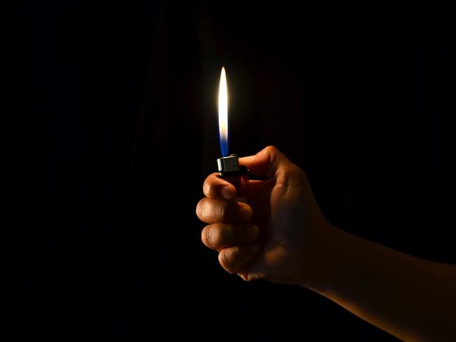 Hand holding lighter. Picture: anankkml/iStock