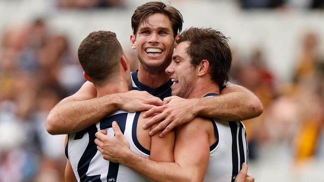 Tom Hawkins celebrates a Geelong goal with teammates.