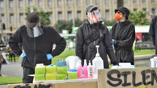 Hand sanitiser and PPE has been handed out to protesters. Picture: Jason Edwards