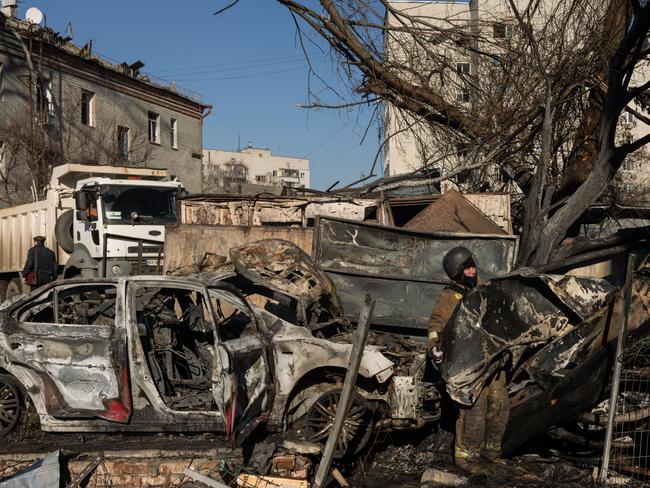 Ukrainian emergency personnel work at the scene of a Russian Iskander ballistic missile attack on a residential building in Kharkiv, Ukraine. Picture: Getty Images