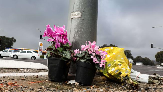 Floral tributes left at the crash scene. Picture: AAP/Russell Millard