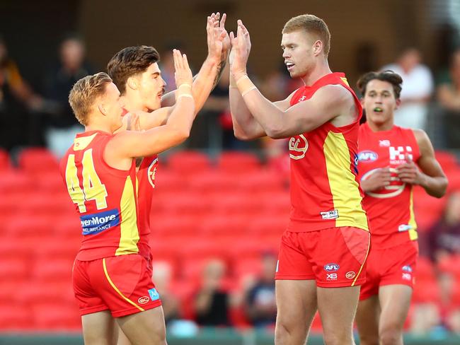 Peter Wright of the Suns celebrates a goal during the round eight AFL match between the Gold Coast Suns and the Melbourne Demons at Metricon Stadium on May 11, 2019 in Gold Coast, Australia. (Photo by Chris Hyde/Getty Images)