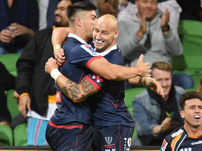 Jack Maddocks (left) and Billy Meakes of the Rebels react after Maddocks scored a try during the Round 4 Super Rugby match between the Melbourne Rebels and the Brumbies at AAMI Park in Melbourne, Friday, March 8, 2019. (AAP Image/Julian Smith) NO ARCHIVING, EDITORIAL USE ONLY