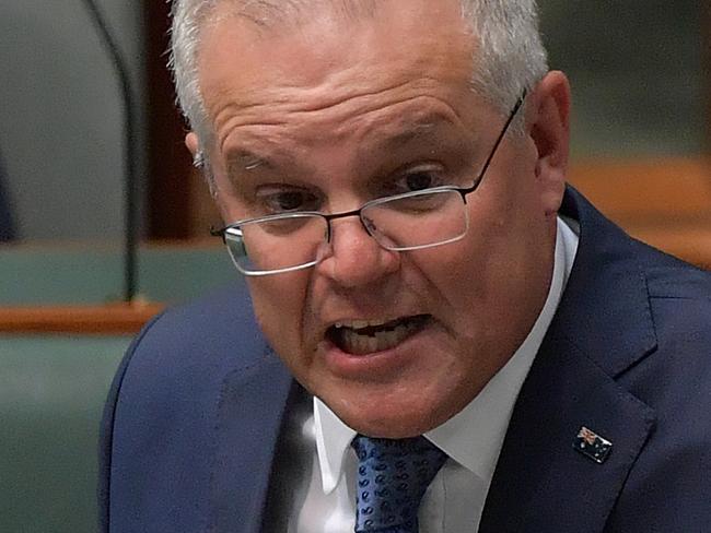 CANBERRA, AUSTRALIA - FEBRUARY 18: Prime Minister Scott Morrison speaks during Question Time in the House of Representatives on February 18, 2021 in Canberra, Australia. Facebook has banned publishers and users in Australia from posting and sharing news content as the Australian government prepares to pass laws that will require social media companies to pay news publishers for sharing or using content on their platforms. (Photo by Sam Mooy/Getty Images)