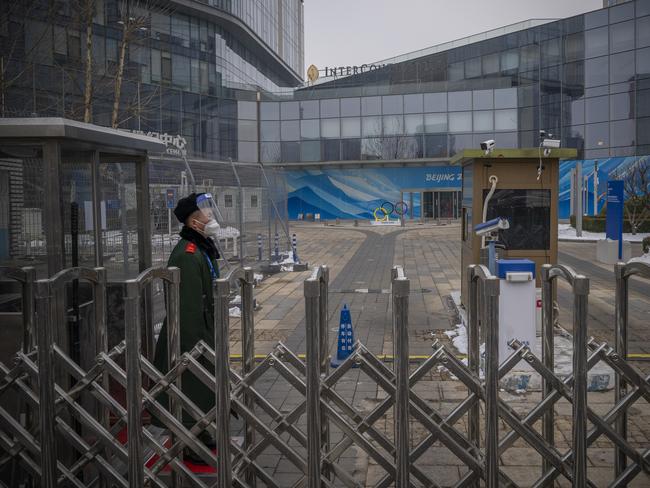 A security guard stands behind a barricade at Olympic Park in Beijing, China. Picture: Andrea Verdelli/Getty Images