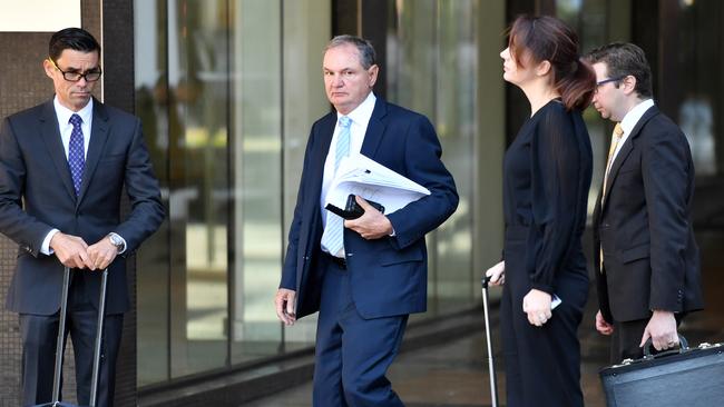 Former Ipswich mayor Paul Pisasale (centre) arrives at court. Picture: AAP/Darren England