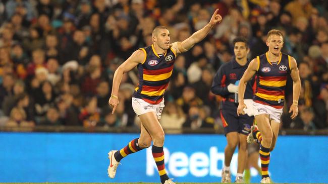 Tim McIntyre celebrates after kicking a goal.