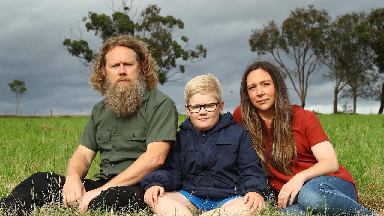 Chris Conner, son Liam and Sarah Ludvig at the site where the Curlewis Community Health hub was supposed to be completed by 2023. Picture: Alison Wynd