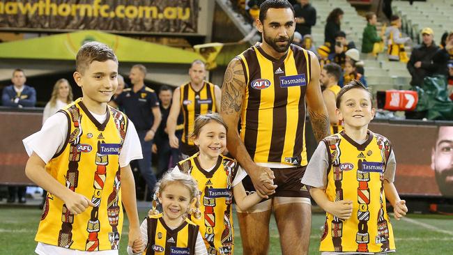 Burgoyne runs out onto the MCG with his kids for his 350th career game. Picture: Michael Klein