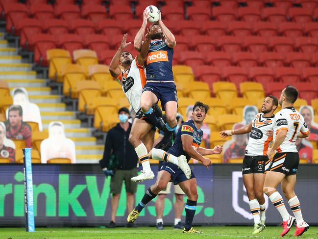 Anthony Don flies high to grab the ball and score a try for the Titans. Picture: Chris Hyde/Getty Images