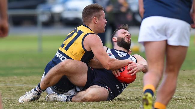 Nick Milne wraps up Andrew Sturgess. Picture: Josie Hayden