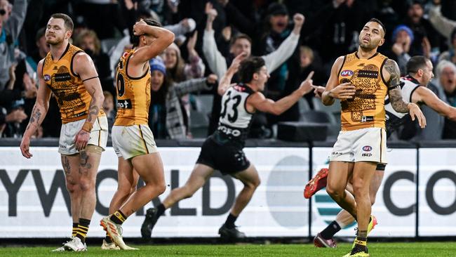 ADELAIDE, AUSTRALIA - MAY 19:  Darcy Byrne-Jones of the Power  celebrates  kicking a  goal to win the game as ,Blake Hardwick James Sicily and  Jarman Impey of the Hawks can't believe it  during the round 10 AFL match between Yartapuulti (the Port Adelaide Power) and Hawthorn Hawks at Adelaide Oval, on May 19, 2024, in Adelaide, Australia. (Photo by Mark Brake/Getty Images)