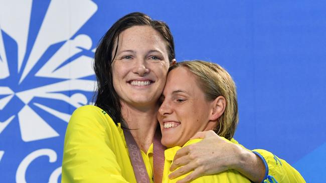 Silver medalist Cate Campbell (left) hugs her sister and gold medalist Bronte Campbell during the medal ceremony for the women’s 100m freestyle final.